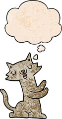 cartoon cat and thought bubble in grunge texture pattern style