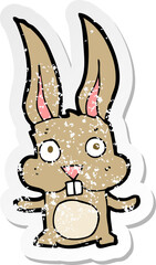 retro distressed sticker of a cartoon rabbit