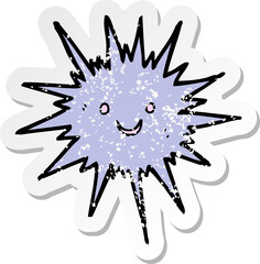 retro distressed sticker of a cartoon sea urchin