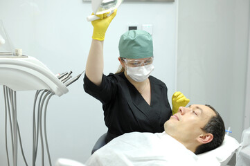 inflatable pillow for dental chair patient raises head doctor puts pillow on him that takes...