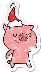 happy distressed sticker cartoon of a pig wearing santa hat