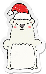 distressed sticker of a cartoon bear wearing christmas hat