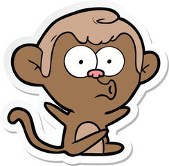 sticker of a cartoon hooting monkey