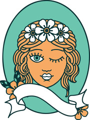 tattoo with banner of a maiden with crown of flowers winking