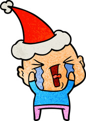 textured cartoon of a crying bald man wearing santa hat