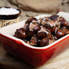 Roasted chestnuts with sea salt. Beautiful background. Rustic. Homemade food. Street food.