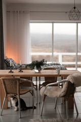 modern dining room interior with panoramic windows and mountain views