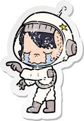 distressed sticker of a cartoon crying astronaut girl
