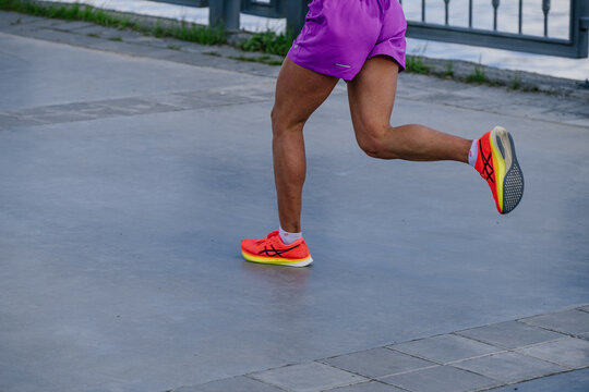 Kazan, Russia - May 17, 2022: legs female runner run race during Kazan Marathon