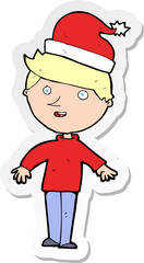 sticker of a cartoon boy in santa hat