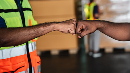 Fototapeta na wymiar Group warehouse workers shake hands to celebrate and be happy in the warehouse., Industrial and industrial concept.
