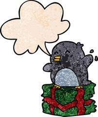 cartoon penguin on wrapped present and speech bubble in retro texture style