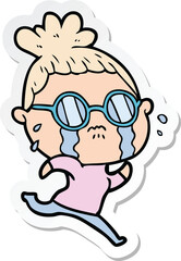 sticker of a cartoon crying woman wearing spectacles