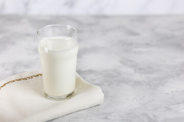 Fresh homemade yogurt in a glass on the table with a place to copy. Selective focus.