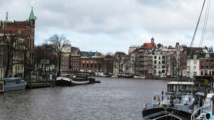 Urban landscape. Water canal in the city (Amsterdam, Netherlands)