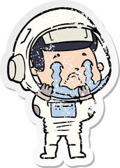 distressed sticker of a cartoon crying astronaut