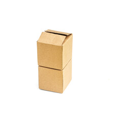 Two square cardboard boxes stand one on top of another, white background