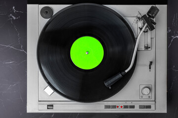 Fototapeta premium Turntable Vinyl records, party music, top view. Empty copy space for record label mockup. Vintage retro sound recording style. Background for the design of a poster, postcard, flyer for music events