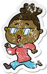 distressed sticker of a cartoon happy woman wearing spectacles