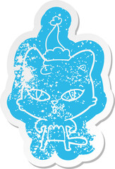 cartoon distressed sticker of a cat wearing santa hat