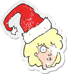 retro distressed sticker of a cartoon woman with santa hat