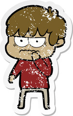 distressed sticker of a annoyed cartoon boy