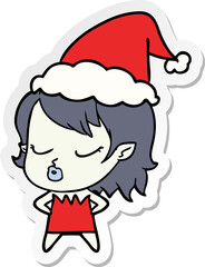 cute sticker cartoon of a vampire girl wearing santa hat