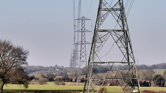 Rows of Lattice Power Line Towers Aerial View