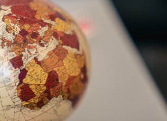 Close up view of the continent of Africa and Europe on a globe on a gray background.