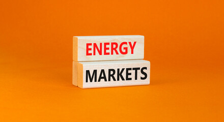 Energy markets symbol. Concept words Energy markets on wooden block. Beautiful orange table orange background. Business energy markets concept. Copy space.