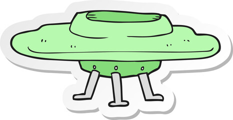 sticker of a cartoon flying saucer