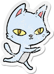distressed sticker of a cartoon cat staring