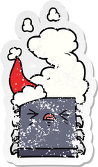 distressed sticker cartoon of a overheating computer chip wearing santa hat