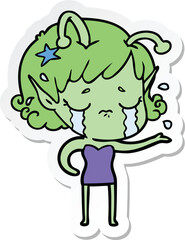 sticker of a cartoon crying alien girl