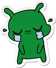 sticker cartoon of cute sad alien