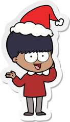 happy sticker cartoon of a boy wearing santa hat