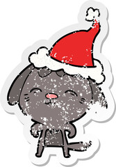 happy distressed sticker cartoon of a dog wearing santa hat