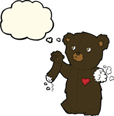 cartoon teddy black bear with torn arm with thought bubble