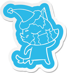 cartoon  sticker of a crying wolf wearing santa hat