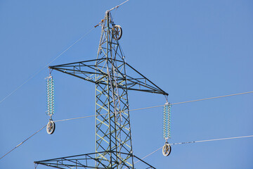 Iron pylon with high voltage cable insulators