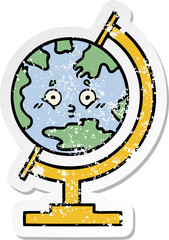 distressed sticker of a cute cartoon globe of the world