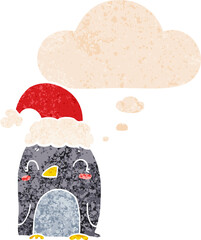 cute christmas penguin and thought bubble in retro textured style