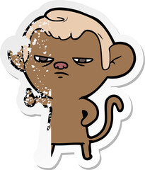 distressed sticker of a cartoon annoyed monkey
