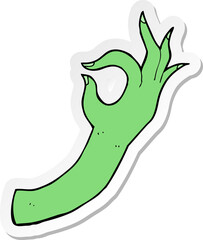 sticker of a cartoon hand symbol