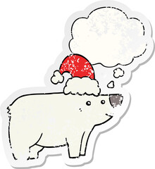 cartoon bear wearing christmas hat and thought bubble as a distressed worn sticker
