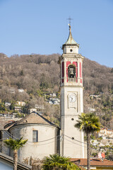 Fototapeta na wymiar The bell tower and the parish church of Cannero