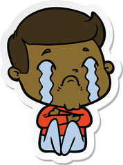 sticker of a cartoon man crying