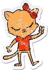distressed sticker of a cute cartoon cat with bow