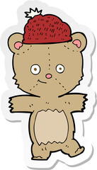 sticker of a cartoon bear in hat