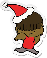 sticker cartoon of a boy with untidy hair wearing santa hat